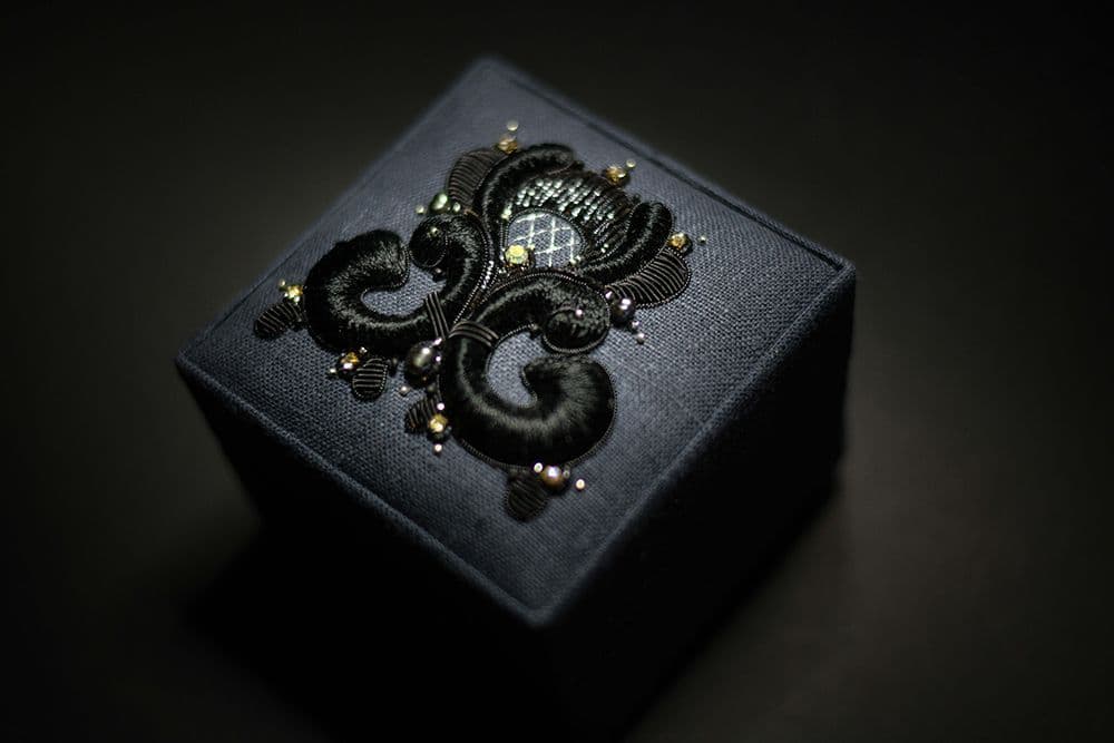a close-up to a hand-embroidered jewellery box decorated with high relief embroidery