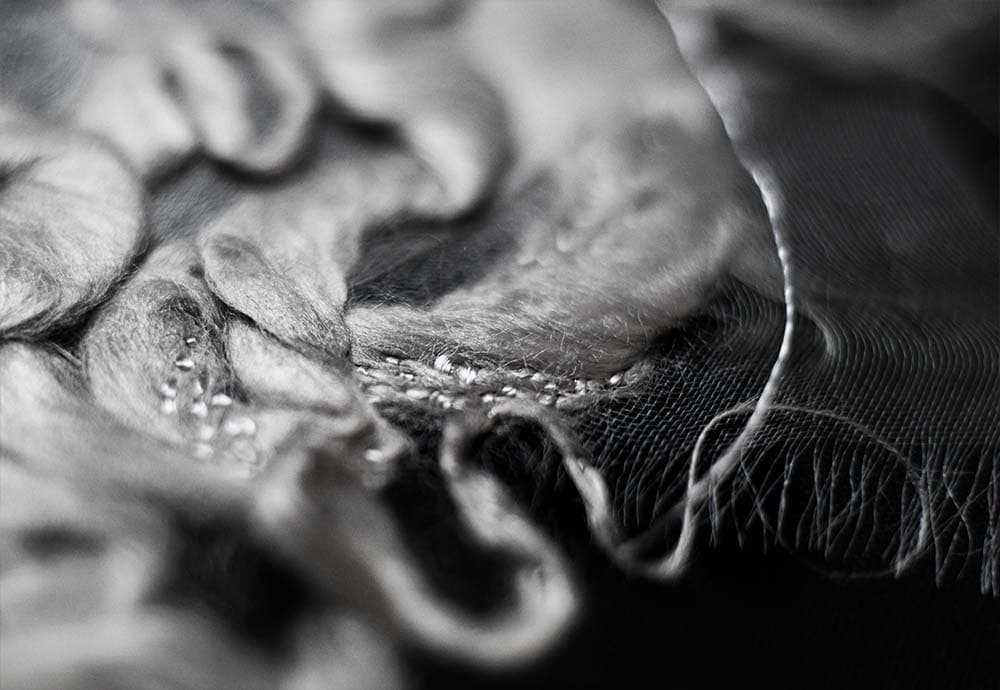 a closeup to the embroidered piece silk mesh and silk fibres