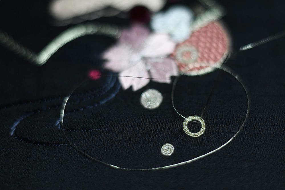 a moment of stitching a closeup of golden element
