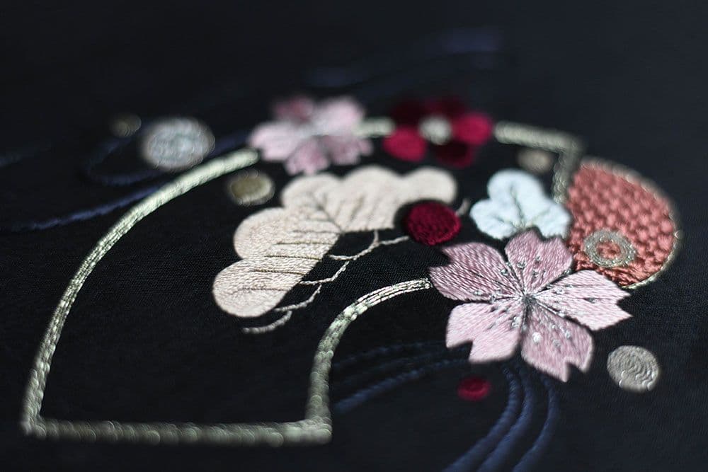 embroidered golden fan