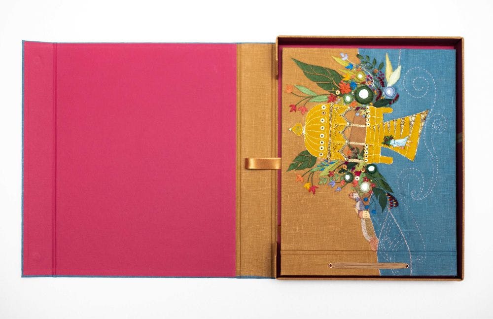 a hand-made photo album decorated with a Needle Turn Appliqué & Embroidery