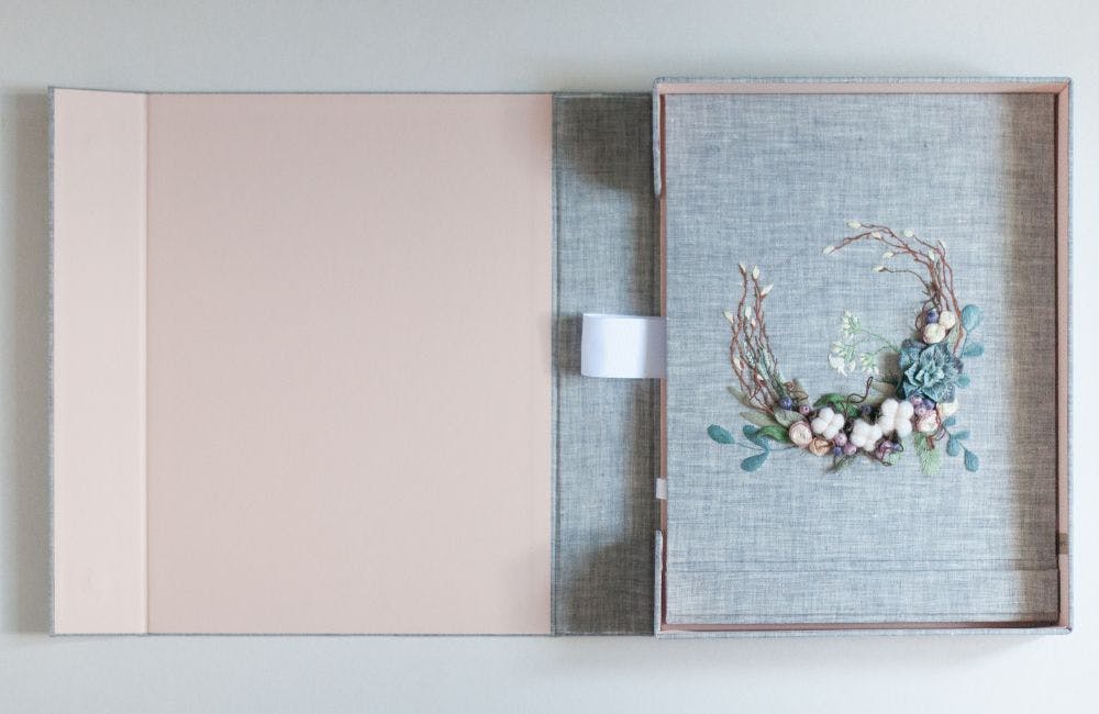a hand-made photo album decorated with 3d embroidery and stumpwork