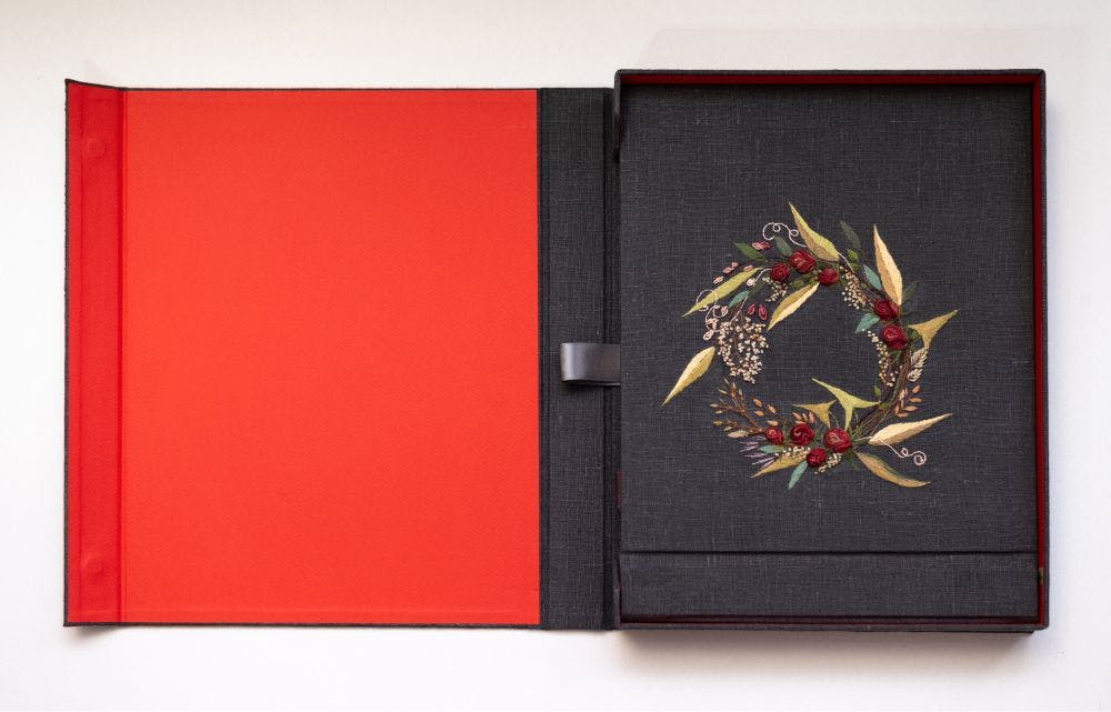 a hand-made photo album decorated with stumpwork embroidery