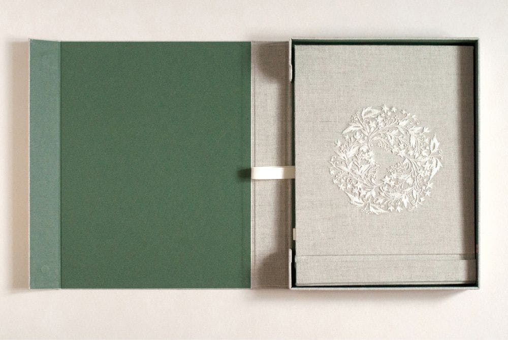 a hand-made photo album decorated with whitework made in raw silk