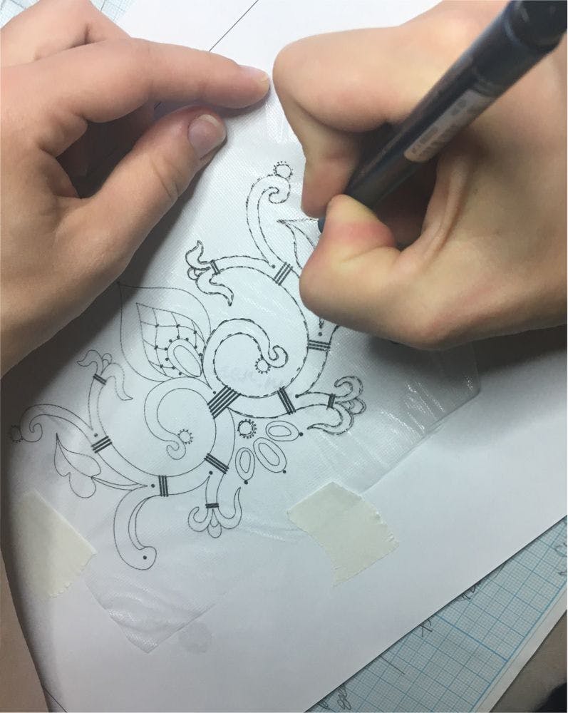 the process of drawing the embroidery pattern