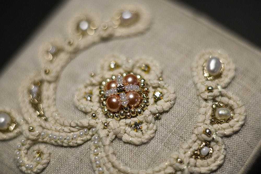 a close-up to a hand-embroidered jewellery box decorated with high relief embroidery