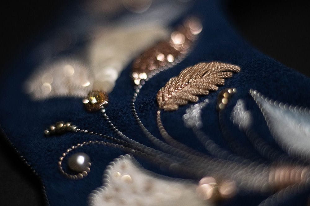 a close-up to the embroidered Goldwork element