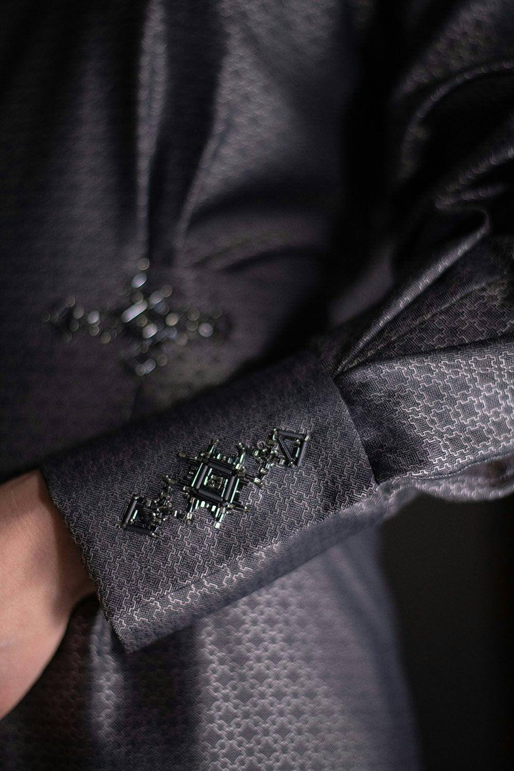 a close-up to the embroidered cuff